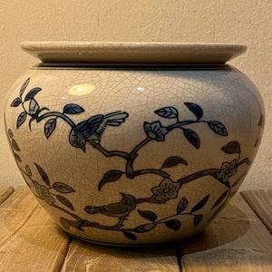 Beautiful planter with blue artwork.